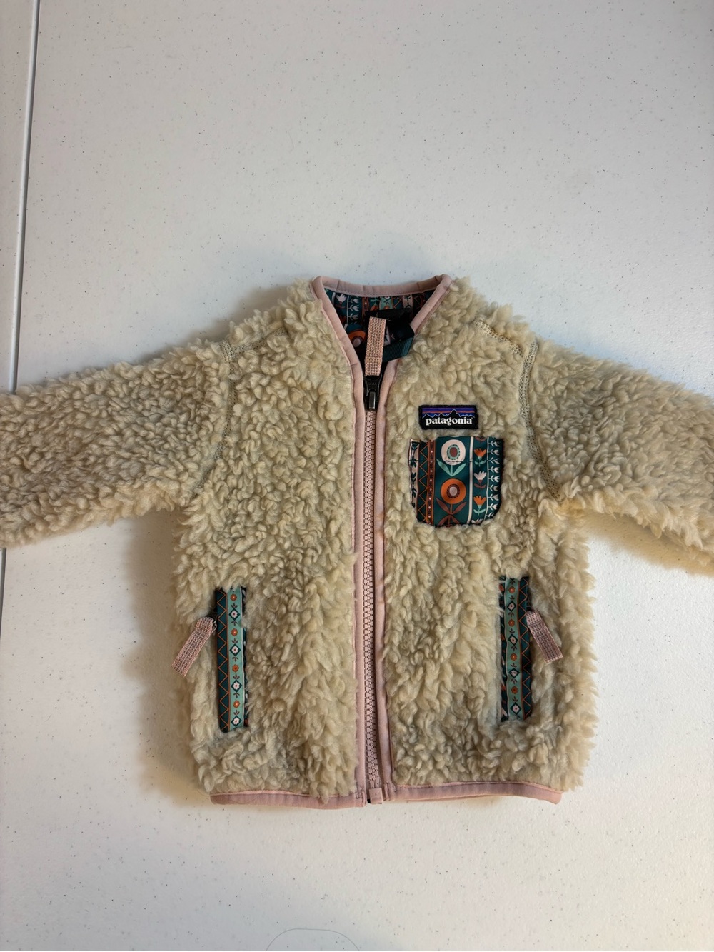 Cream colored Patagonia Baby Retro-X® Jacket
Size 3-6 Months